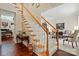 Elegant staircase leading to the upper level, showcasing hardwood accents and a carpet runner at 1720 Mountain Park Dr, Charlotte, NC 28214