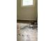 Bedroom showing damaged floors near a window at 1769 S Nc 16 Hwy, Denver, NC 28037