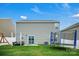 Spacious backyard with a well-maintained lawn, patio seating, and a trampoline for outdoor enjoyment at 2013 Eastway Dr, Dallas, NC 28034