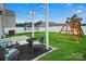 Spacious backyard with patio area, play set, swing set and trampoline at 2013 Eastway Dr, Dallas, NC 28034