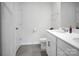 Bright bathroom featuring a double sink vanity, modern fixtures, and a clean, minimalist design at 2013 Eastway Dr, Dallas, NC 28034
