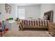 Bright bedroom with large window, neutral carpet, and decoratively painted construction trucks art print at 2013 Eastway Dr, Dallas, NC 28034