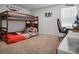 Playful carpeted bedroom with bunk beds, desk, and window offering natural light at 2013 Eastway Dr, Dallas, NC 28034
