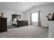 Spacious bedroom with vaulted ceilings, neutral carpet, and a large window for natural light at 2013 Eastway Dr, Dallas, NC 28034