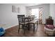 Bright dining room with a wooden table and chairs, natural light, and modern decor at 2013 Eastway Dr, Dallas, NC 28034