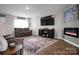 Inviting living room with modern decor, a sleek fireplace, and comfortable seating at 2013 Eastway Dr, Dallas, NC 28034