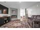 Cozy living room featuring a fireplace, stylish furniture, and hardwood floors at 2013 Eastway Dr, Dallas, NC 28034