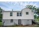 Rear exterior view of the home featuring a stairwell and fenced-in yard at 2108 Twin Ave, Gastonia, NC 28052