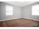 This cozy bedroom has neutral paint, clean white trim, and good light from the double windows at 2108 Twin Ave, Gastonia, NC 28052