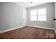 This cozy bedroom has neutral paint, clean white trim, and good light from the double windows at 2108 Twin Ave, Gastonia, NC 28052