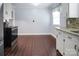 Spacious kitchen featuring stainless steel appliances, granite counters, white cabinetry, and tile flooring at 2108 Twin Ave, Gastonia, NC 28052