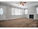 Inviting living room with neutral walls, plush carpeting, a fireplace, and ample natural light at 2108 Twin Ave, Gastonia, NC 28052