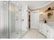 Contemporary bathroom showcasing a glass-enclosed shower with neutral finishes and a dual vanity at 21621 Crown Lake Dr, Cornelius, NC 28031