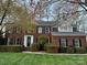 Traditional brick two-story home with manicured lawn and black shutters, offering classic curb appeal at 21621 Crown Lake Dr, Cornelius, NC 28031