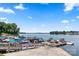 Stunning waterfront view with private boat dock and multiple boats ready for lake adventures at 21621 Crown Lake Dr, Cornelius, NC 28031