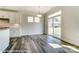 Bright dining area with wood floors and sliding glass doors to the backyard at 2227 Caravan Ln # 43, Denver, NC 28164