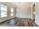 Spacious dining room with elegant wainscoting, modern light fixture, and natural light at 2227 Caravan Ln # 43, Denver, NC 28164