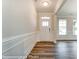 Bright entryway with decorative molding, wood flooring, and a clear view to the outside at 2227 Caravan Ln # 43, Denver, NC 28164