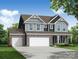Charming two-story home featuring a three-car garage, stone accents, and classic architectural details at 2227 Caravan Ln # 43, Denver, NC 28164