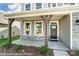 Inviting front porch with stone accents, sturdy support beams, and clear numbering on the front at 2227 Caravan Ln # 43, Denver, NC 28164