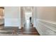 Hallway featuring elegant wainscoting and attractive wood floors for a classic and refined look at 2227 Caravan Ln # 43, Denver, NC 28164