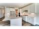 Beautiful kitchen with an island, stainless appliances, white cabinets, and stylish backsplash at 2227 Caravan Ln # 43, Denver, NC 28164
