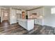Bright kitchen with white cabinets, large island, stainless steel appliances and modern finishes at 2227 Caravan Ln # 43, Denver, NC 28164
