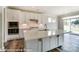 Bright kitchen with large island, stainless appliances, and white cabinetry, perfect for entertaining at 2227 Caravan Ln # 43, Denver, NC 28164
