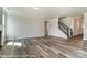 Living room showcasing hardwood floors and staircase with modern design at 2227 Caravan Ln # 43, Denver, NC 28164