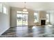 Spacious living room with a fireplace, large windows, and sliding glass door at 2227 Caravan Ln # 43, Denver, NC 28164