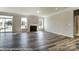 Living room featuring a fireplace, hardwood floors, and natural light from large windows at 2227 Caravan Ln # 43, Denver, NC 28164
