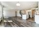 Open floorplan showcasing the kitchen, living area, and staircase with modern finishes at 2227 Caravan Ln # 43, Denver, NC 28164