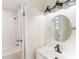 Bathroom boasts white tile, modern fixtures, and a tub/shower combination at 2280 Cannon Farm Rd, China Grove, NC 28023