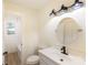 Stylish bathroom with modern lighting, fixtures, vanity, and tile tub surround at 2280 Cannon Farm Rd, China Grove, NC 28023
