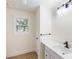 Modern bathroom with a white vanity, stylish fixtures, and a bright window with a view at 2280 Cannon Farm Rd, China Grove, NC 28023