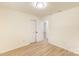 Neutral bedroom with hardwood floors, a double-door closet, and a view into another room at 2280 Cannon Farm Rd, China Grove, NC 28023