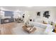 Sunlit living room with modern furnishings, wood floors and eat-in kitchen at 2280 Cannon Farm Rd, China Grove, NC 28023