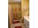 Cozy bathroom with unique decor and a white vanity for a warm, inviting space at 2777 Old South Nw Ct, Concord, NC 28027