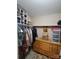 Walk-in closet features built-in shelving, hanging racks and a dresser for maximum storage at 2777 Old South Nw Ct, Concord, NC 28027