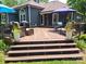 Multi-level deck features various seating arrangements and stylish outdoor decor for comfortable outdoor living at 2777 Old South Nw Ct, Concord, NC 28027