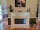 Elegant fireplace with decorative mantel and glass screen at 2777 Old South Nw Ct, Concord, NC 28027