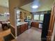 Bright kitchen featuring wood cabinets, stainless steel appliances, and tile flooring at 2777 Old South Nw Ct, Concord, NC 28027