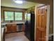 Kitchen view highlighting stainless steel appliances, wood cabinets, and double windows at 2777 Old South Nw Ct, Concord, NC 28027