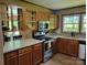 Kitchen featuring wood cabinets, stainless steel appliances, and tile countertops at 2777 Old South Nw Ct, Concord, NC 28027