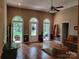 Spacious living room with hardwood floors, large windows, and neutral decor at 2777 Old South Nw Ct, Concord, NC 28027
