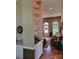 Open-concept living area with hardwood floors, built-in shelving, and large windows at 2777 Old South Nw Ct, Concord, NC 28027