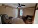 Cozy living room with comfortable seating, a ceiling fan, neutral carpet and natural light from the window at 2777 Old South Nw Ct, Concord, NC 28027