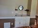 Wet bar featuring white cabinets and drawers, and backsplash at 2777 Old South Nw Ct, Concord, NC 28027