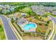 An aerial view of community pool, playground, picnic shelter, and surrounding homes at 2785 Disney Pl, Indian Land, SC 29707