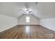 Spacious attic with vaulted ceilings, hardwood floors, and natural light at 2785 Disney Pl, Indian Land, SC 29707
